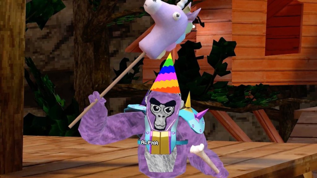 Un gorila morado con sombrero de cumpleaños.